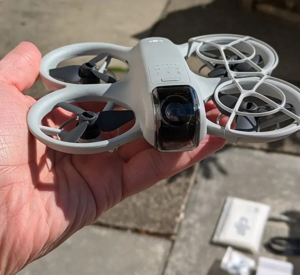 Close-up of DJI Neo held in a person's hand
