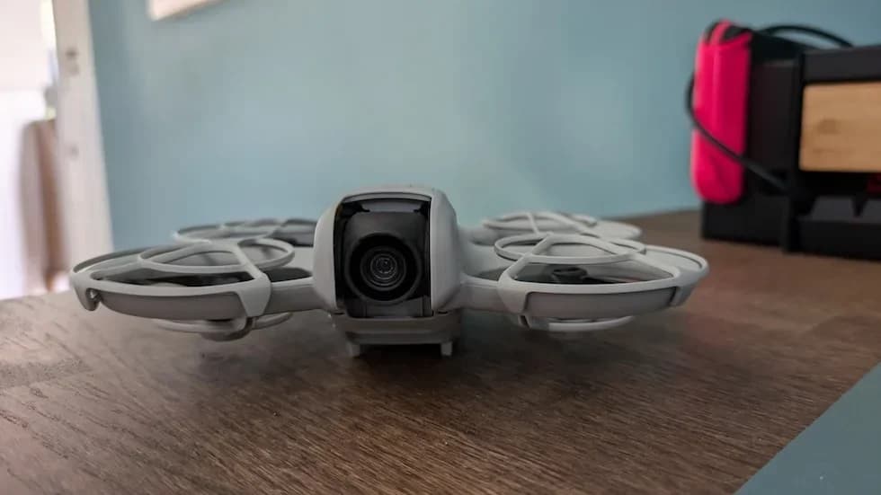 Close-up of DJI Neo resting on a wooden surface indoors