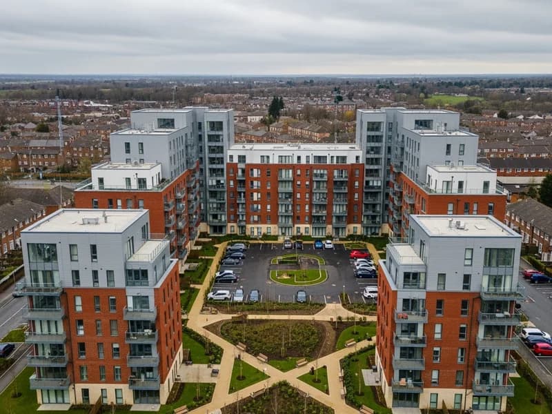 Stunning aerial real estate photography of modern residential development with symmetrical courtyard design