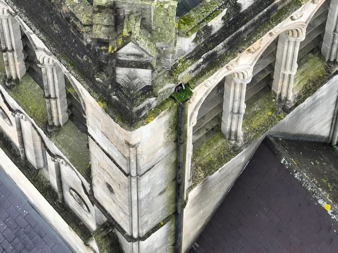 Professional drone assessing structural integrity of commercial roof system