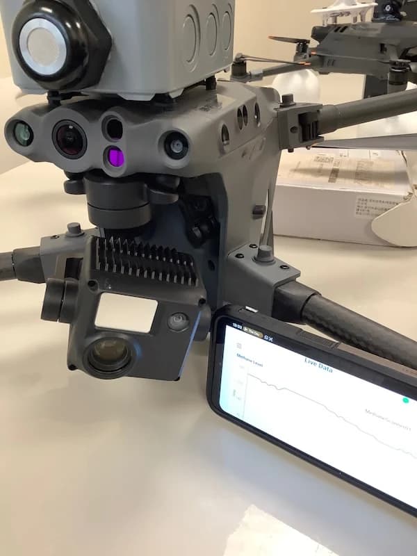 Pilot with OGI camera tablet showing methane detection