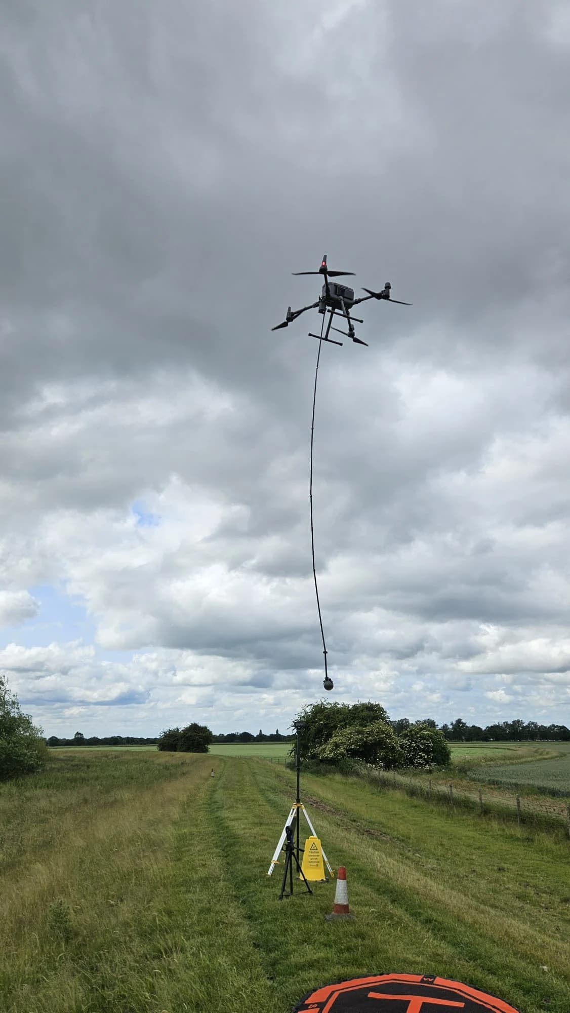 Professional drone operator with water monitoring equipment