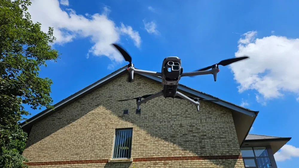 Pilot assessing gust factor at a UK site before flight