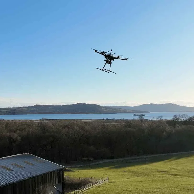 Drone in flight against an open sky
