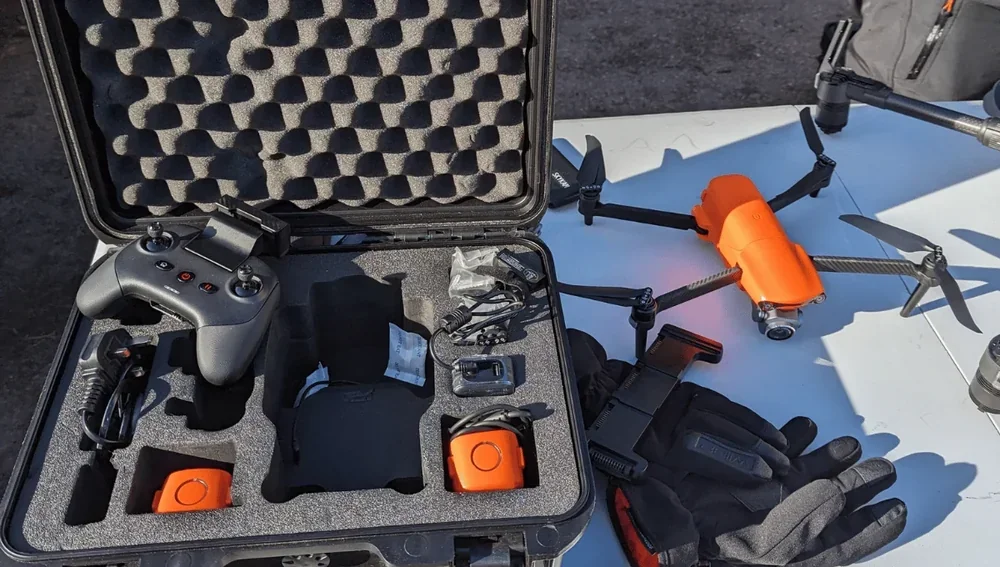 Drone operator monitoring RTH on flight app