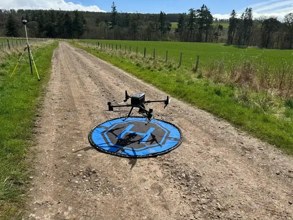 Drone survey technician prepping payload
