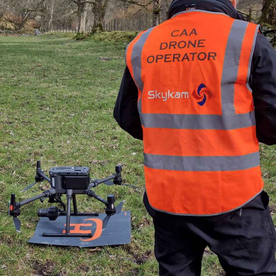 CAA-approved drone operator in Skykam hi-vis with Matrice drone