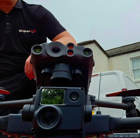Skykam drone pilot with DJI Matrice multi-sensor payload close-up