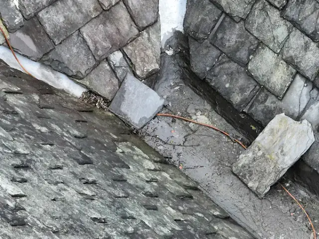 Aerial drone view of residential roof tiles and ridge line